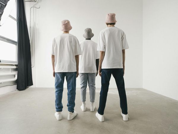 Diverse group of people meditating peacefully in a bright studio.